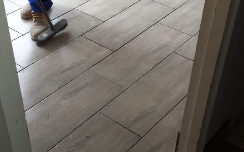 floor tiling done cleaning up.